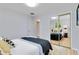 Bedroom with mirrored closet doors showing bed, decor and natural light at 11433 Carlile St, Northglenn, CO 80233
