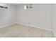 Bedroom featuring neutral walls, wood-look flooring, and windows letting in natural light at 11433 Carlile St, Northglenn, CO 80233