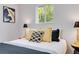 Bedroom featuring window light and decorative bedside lamps and pillows at 11433 Carlile St, Northglenn, CO 80233