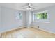 Light-filled bedroom with wood floors and large windows at 11433 Carlile St, Northglenn, CO 80233
