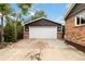 Detached garage with a white door and space for parking at 11433 Carlile St, Northglenn, CO 80233