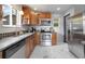 A well-equipped kitchen with stainless steel appliances and marble-look flooring at 11433 Carlile St, Northglenn, CO 80233