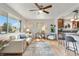 Cozy living room with open kitchen view, stylish furnishings, and hardwood flooring at 11433 Carlile St, Northglenn, CO 80233