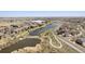 Beautiful aerial view of the community featuring lush landscaping, ponds, and walking paths at 871 E 98Th Ave # 1402, Thornton, CO 80229