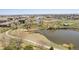 Picturesque aerial view of the community showcasing walking paths, ponds, and mature trees at 871 E 98Th Ave # 1402, Thornton, CO 80229