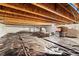 Clean unfinished basement space, perfect for storage or future expansion with exposed ceiling and plastic ground covering at 871 E 98Th Ave # 1402, Thornton, CO 80229