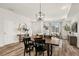 Spacious dining area with hardwood floors, modern light fixtures, and a welcoming atmosphere at 871 E 98Th Ave # 1402, Thornton, CO 80229