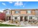 Inviting townhome featuring charming exteriors, landscaped front yard, and private entrances at 871 E 98Th Ave # 1402, Thornton, CO 80229