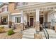 Charming front porch with stone accents and cozy seating area, perfect for relaxing outdoors at 871 E 98Th Ave # 1402, Thornton, CO 80229