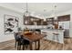 Modern kitchen features granite countertops, stainless steel appliances, and dark wood cabinetry at 871 E 98Th Ave # 1402, Thornton, CO 80229