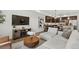 Open-concept living room featuring modern décor, hardwood floors, and an inviting ambiance at 871 E 98Th Ave # 1402, Thornton, CO 80229