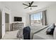 Comfortable main bedroom features neutral colors, a ceiling fan, a large window, and ample closet space at 871 E 98Th Ave # 1402, Thornton, CO 80229