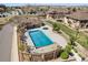 Inviting aerial view of the community pool with well-maintained landscaping and ample deck space at 871 E 98Th Ave # 1402, Thornton, CO 80229