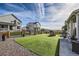 Landscaped backyard with artificial turf and playhouse at 1173 Williams Loop, Elizabeth, CO 80107