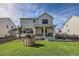 House exterior and backyard with playhouse and patio at 1173 Williams Loop, Elizabeth, CO 80107