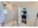 Main bathroom features a walk-in shower and access to bedroom at 1173 Williams Loop, Elizabeth, CO 80107