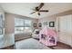 Cozy bedroom with ceiling fan and playful area at 1173 Williams Loop, Elizabeth, CO 80107