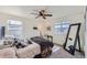 Bright bedroom with ceiling fan, window seating and large mirror at 1173 Williams Loop, Elizabeth, CO 80107