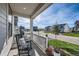 Front porch view of a quiet tree-lined street with other homes at 1173 Williams Loop, Elizabeth, CO 80107