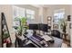 Home office with a large desk, two monitors, and ample natural light at 1173 Williams Loop, Elizabeth, CO 80107
