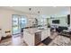 Open concept kitchen with granite island, stainless steel appliances, and view of backyard at 1173 Williams Loop, Elizabeth, CO 80107