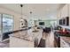 Open concept kitchen with island, stainless steel appliances, and living room view at 1173 Williams Loop, Elizabeth, CO 80107
