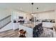 Modern kitchen features a large island with seating and stainless steel appliances at 1173 Williams Loop, Elizabeth, CO 80107