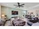 Open concept living area with dining area, kitchen view, and hardwood floors at 1173 Williams Loop, Elizabeth, CO 80107