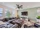 Spacious living room with sectional sofa, large TV, and accent wall at 1173 Williams Loop, Elizabeth, CO 80107