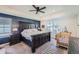 Spacious main bedroom with dark wood furniture and ceiling fan at 1173 Williams Loop, Elizabeth, CO 80107