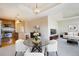 Open floor plan with a kitchen, dining area, and living room with a neutral color scheme at 1827 N Grant St # 1104, Denver, CO 80203