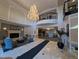 Elegant lobby area with a grand chandelier, fireplace, seating area, and elevator access at 1827 N Grant St # 1104, Denver, CO 80203
