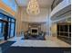 Elegant lobby featuring a fireplace, chandelier, and comfortable seating area at 1827 N Grant St # 1104, Denver, CO 80203