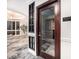 Wine cellar entrance with glass door and sign in luxurious interior space at 1827 N Grant St # 1104, Denver, CO 80203