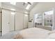 Bright bedroom with skylights, vaulted ceiling, and a large closet at 9661 W Chatfield Ave # B, Littleton, CO 80128