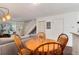 Bright dining area is adjacent to the living room and features seating for four and ample natural light at 9661 W Chatfield Ave # B, Littleton, CO 80128