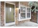 Exterior shot of a home's front door with stone facade at 9661 W Chatfield Ave # B, Littleton, CO 80128