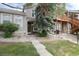 Charming townhome with a welcoming front entrance, attractive landscaping, and a well-maintained exterior at 9661 W Chatfield Ave # B, Littleton, CO 80128