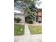 Charming home with well-manicured lawn, mature trees and a stone facade at 9661 W Chatfield Ave # B, Littleton, CO 80128