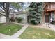 Charming home with a well-manicured lawn and mature tree at 9661 W Chatfield Ave # B, Littleton, CO 80128