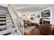 Cozy living room boasts a fireplace, decorative shelving, and a comfortable seating arrangement at 9661 W Chatfield Ave # B, Littleton, CO 80128