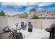 Private patio with seating, grill, and fenced-in yard for outdoor enjoyment at 9661 W Chatfield Ave # B, Littleton, CO 80128