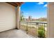 Outdoor balcony features iron railings with views of the street and landscaping at 981 S Sable Blvd # 107, Aurora, CO 80012