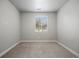 Spacious bedroom with a window and neutral carpet, ready for your personal touch at 981 S Sable Blvd # 107, Aurora, CO 80012
