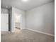 Comfortable bedroom leading to a bright bathroom and a closet, all neutrally painted at 981 S Sable Blvd # 107, Aurora, CO 80012