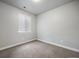 Clean bedroom with a window and neutral carpet providing a calming atmosphere at 981 S Sable Blvd # 107, Aurora, CO 80012