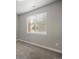 Bright bedroom featuring a window with blinds and neutral carpet, ready for you at 981 S Sable Blvd # 107, Aurora, CO 80012