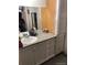 Bathroom with a granite vanity top, providing ample counter space at 1300 S Parker Rd # 212, Denver, CO 80231