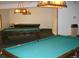 Well-lit game room featuring multiple classic billiard tables and a vintage aesthetic at 1300 S Parker Rd # 212, Denver, CO 80231