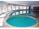 Bright indoor pool area with large windows and a hot tub provides a resort-like feel all year round at 1300 S Parker Rd # 212, Denver, CO 80231